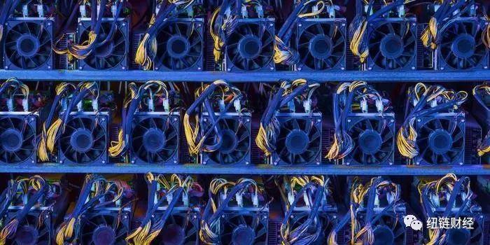 Technicians inspect mining equipment in a cooled environment within a mining farm.