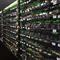 An aerial view of a large-scale mining farm with rows of mining rigs