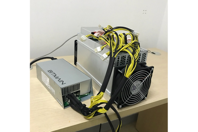 A close-up of a high-powered mining rig with multiple GPUs
